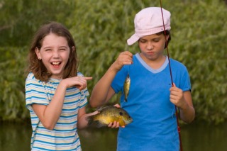 Kids fishing for Bluegills in a Pond